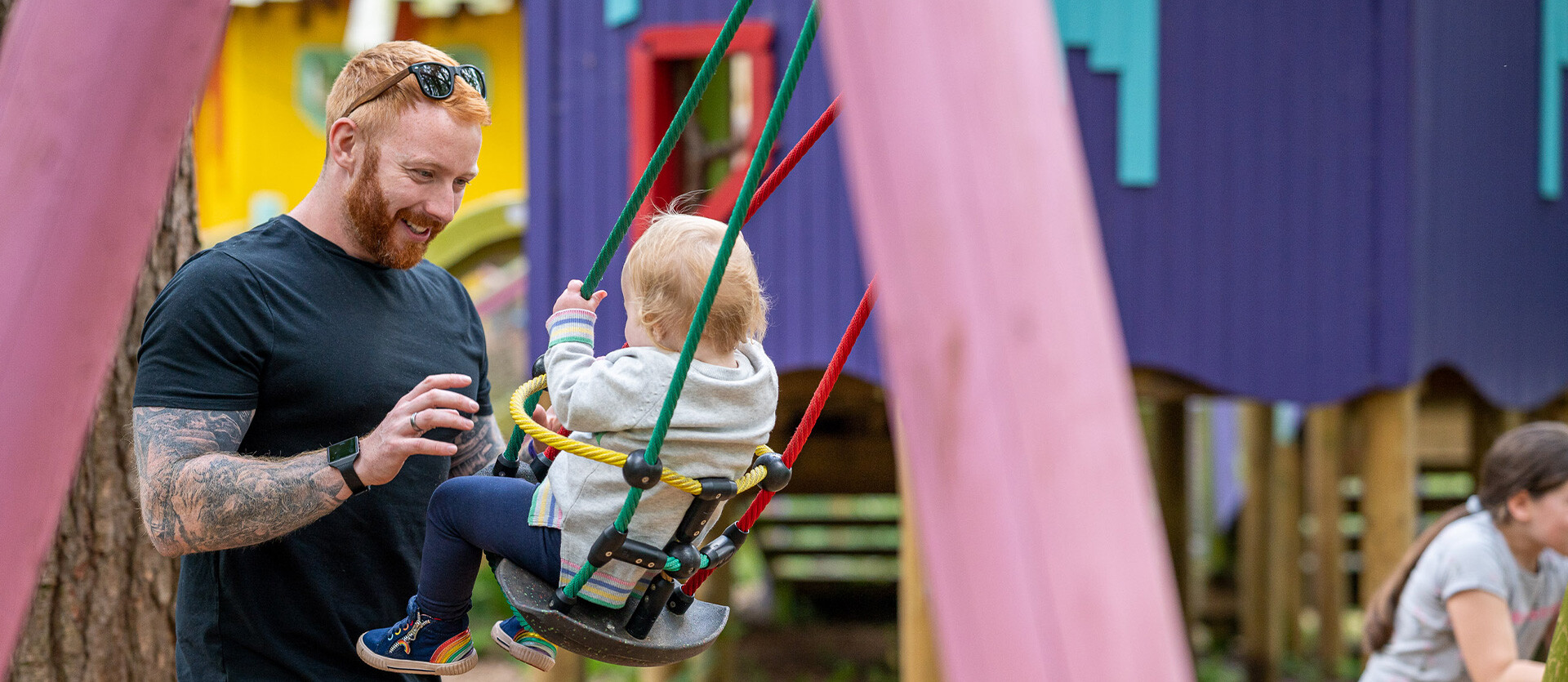 A father and toddler play together at BeWILDerwood