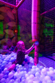 Girl playing in the ball pit at Minty Land