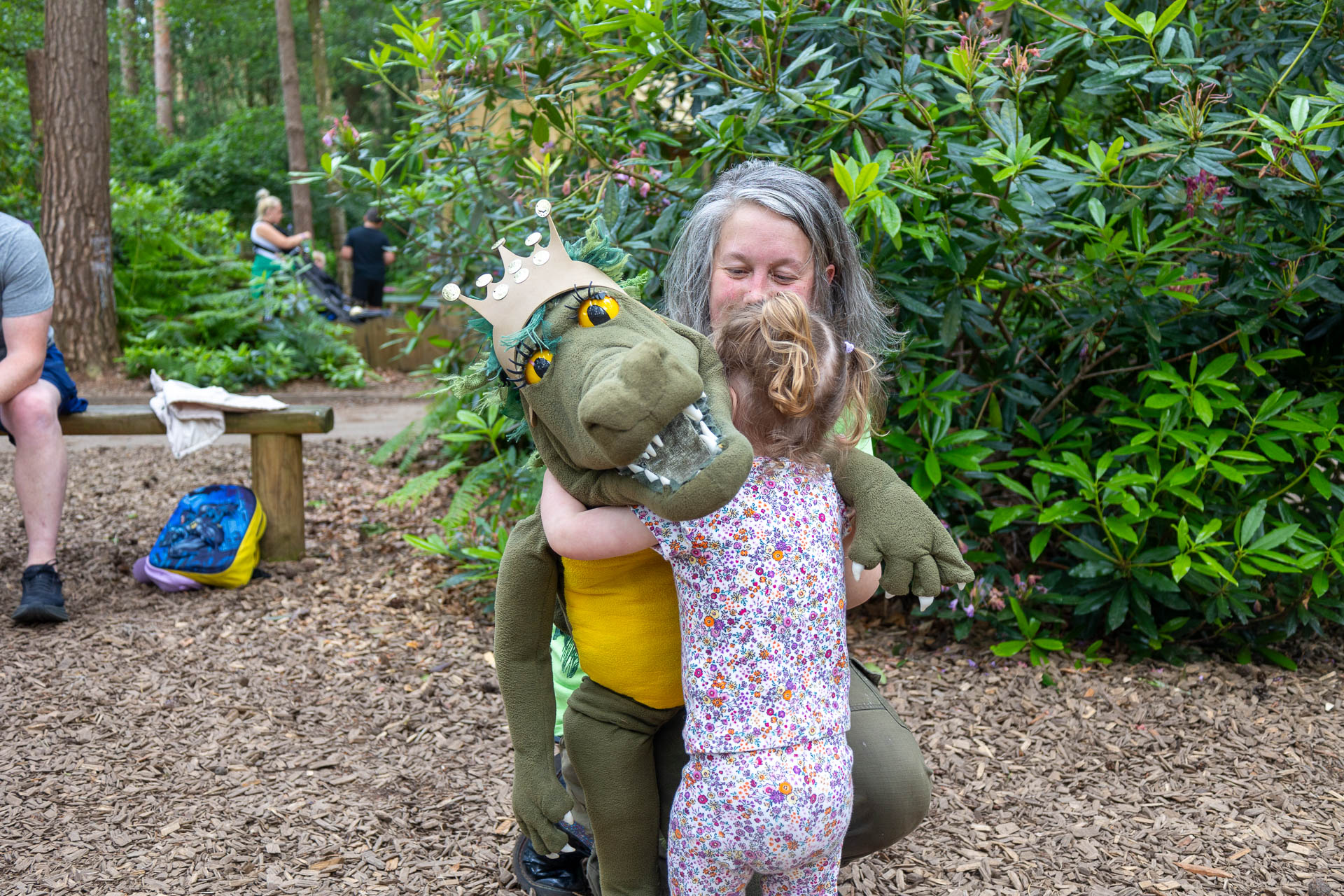 Toddler hugging a puppet at bewilderwood