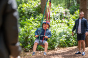 toddler on small zip line for toddlers