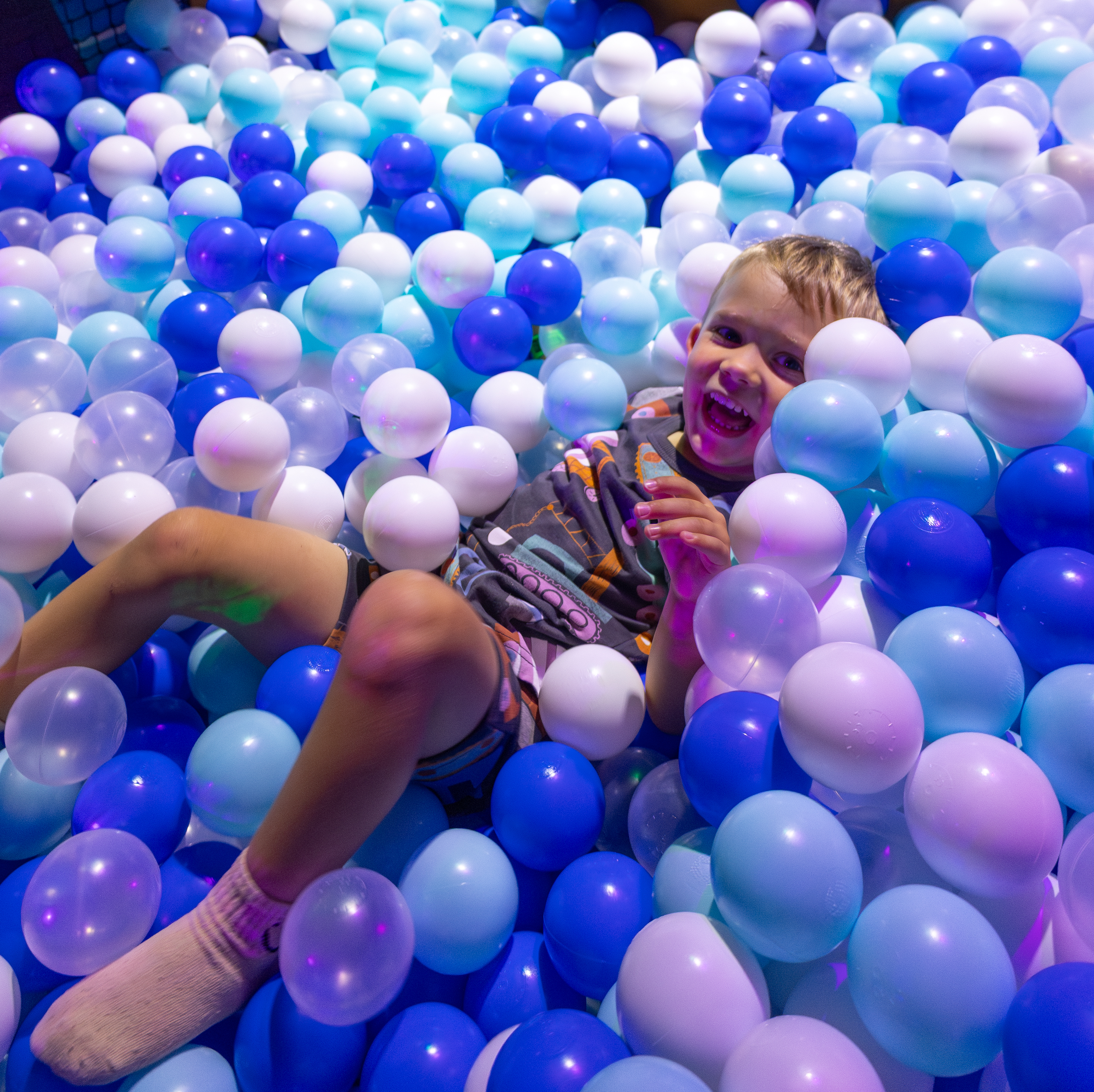 Boy in ball pit at Minty Land
