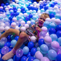 Boy in ball pit at Minty Land
