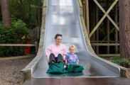 Mum and daughter on a slide at bewilderwood