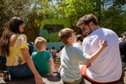 Family watch a show at bewilderwood