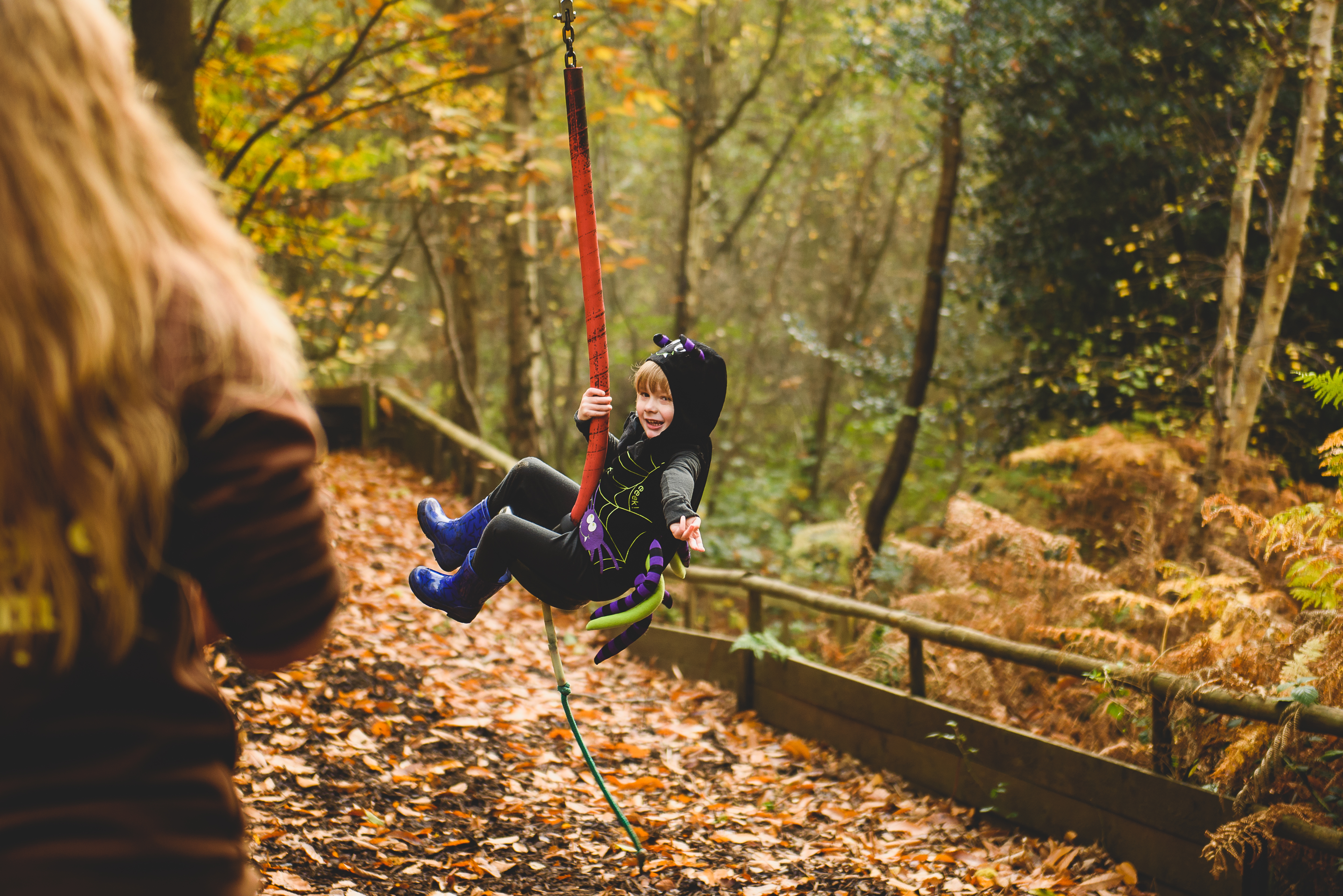 Boy in fancy dress on zip wire